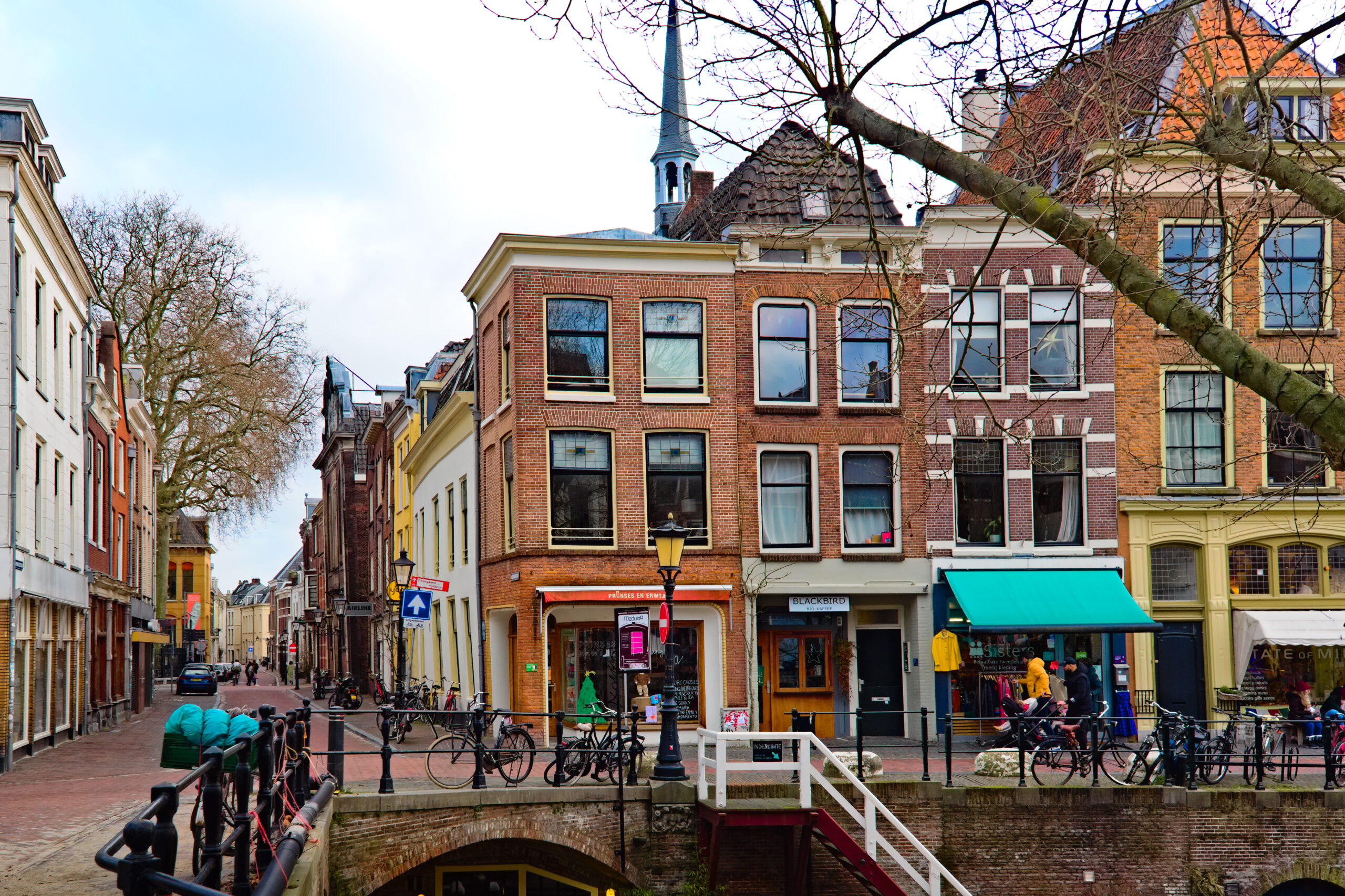 View on the Hamburgerstraat and the Oudegracht in Utrecht The Netherlands. In the background the tower of the Lutherse kerk (church) is visible.